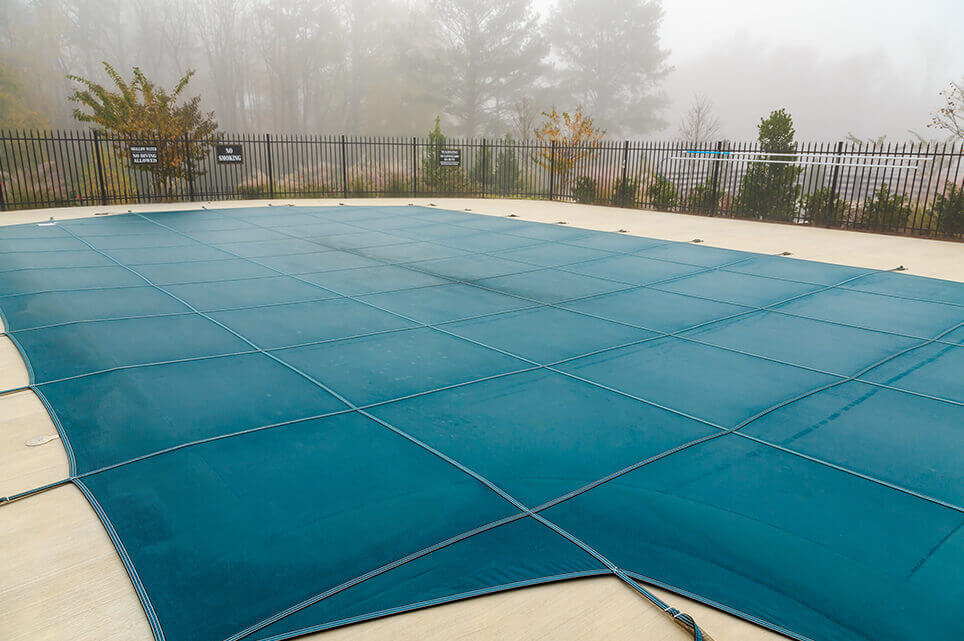 Toronto pool closed for winter with blue pool cover