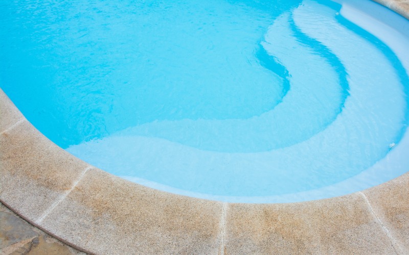 blue swimming pool background summer and water concept