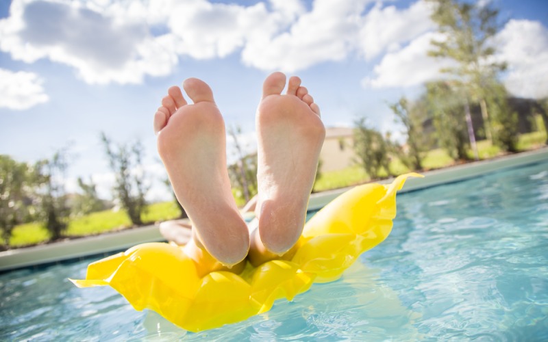 beautiful feet toes floating swimming pool