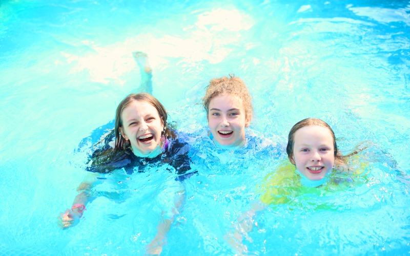 young friends pool water