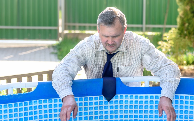 handsome man business suit by pool